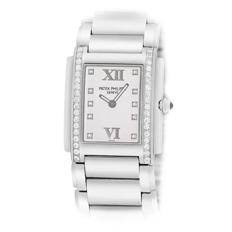 PATEK PHILIPPE STAINLESS STEEL 25MM DIAMOND 4910 TWENTY-4 BOX WARRANTY MINTY: PATEK PHILIPPE STAINLESS STEEL 25MM DIAMOND 4910 TWENTY-4 BOX WARRANTY MINTY BRAND: Patek Philippe Model: Twenty-4 Reference No: 4910/10A - 011 Gender: Lady’s Movement: Swiss Quartz Accuracy Movemen