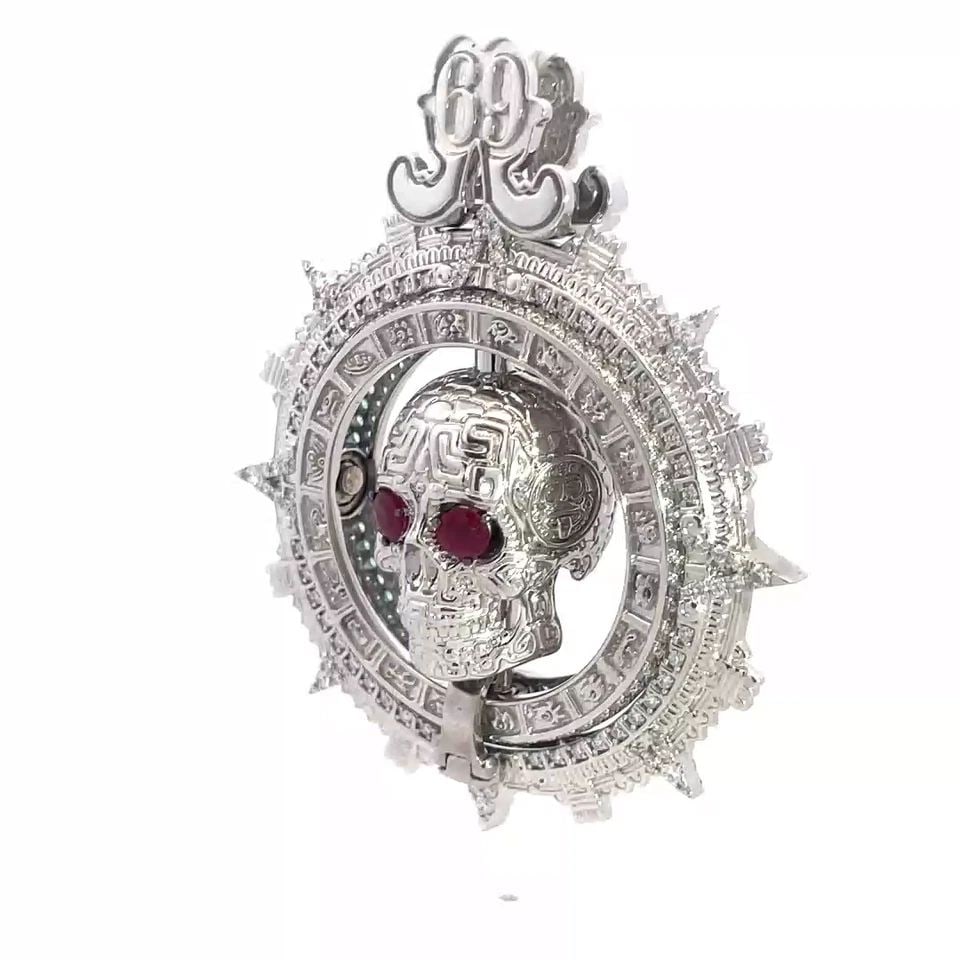 DIAMOND & GEMS GOLD SKULL PENDANT WERNER BERG MUSEUM 18K WHITE: DIAMOND & GEMS GOLD SKULL PENDANT WERNER BERG MUSEUM 18K WHITE This stunning and impressive detail calavera skull is from the Werner Berg Museum by Hortensia. It is crafted from 17 to 18k white gold a