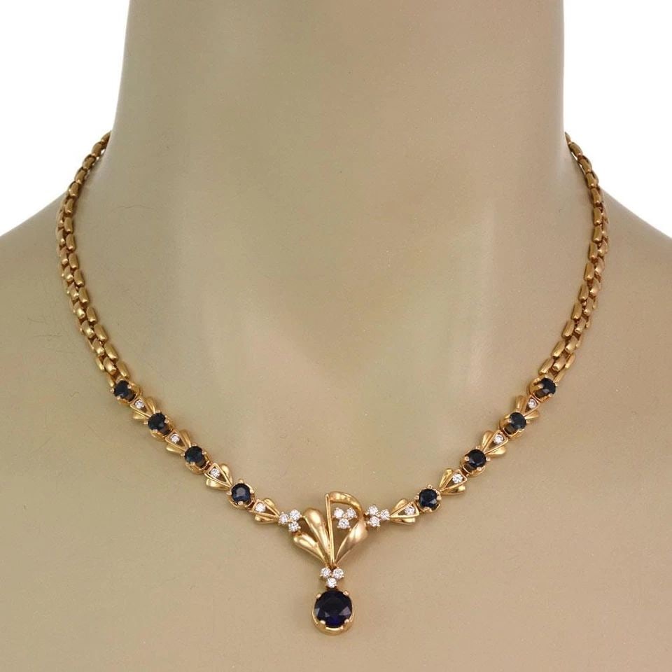 LOVELY 4.70CT SAPPHIRE & DIAMOND 18K YELLOW GOLD FLORAL NECKLACE LIQUIDATION: LOVELY 4.70CT SAPPHIRE & DIAMOND 18K YELLOW GOLD FLORAL NECKLACE Lovely 4.70ct Sapphire & Diamond 18k Yellow Gold Floral Necklace Description This elegant floral necklace is crafted from 18k yellow go