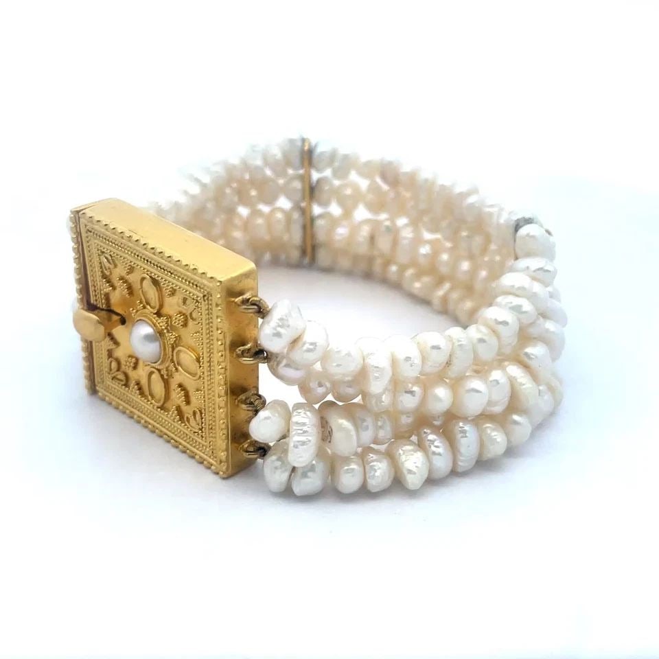 6833 ILIAS LALAOUNIS 22K GOLD PEARLS BRACELET YELLOW 4 STRAND BAROQUE ETRUSCAN: 6833 ILIAS LALAOUNIS 22K GOLD PEARLS BRACELET YELLOW 4 STRAND BAROQUE ETRUSCAN Beautiful and authentic from Ilias Lalaounis, this vintage designer bracelet is crafted from 22k yellow gold with 4 stran