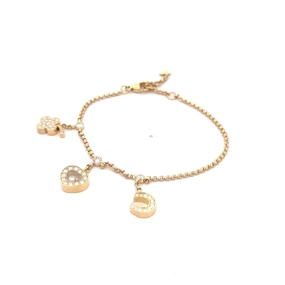 6757 CHOPARD HAPPY DIAMOND GOLD BRACELET 18K YELLOW LUCKY CHARMS: 6757 CHOPARD HAPPY DIAMOND GOLD BRACELET 18K YELLOW LUCKY CHARMS An adorable authentic bracelet by Chopard, from the Happy Diamond Lucky Charms Collection. It is crafted from 18k yellow gold featuring