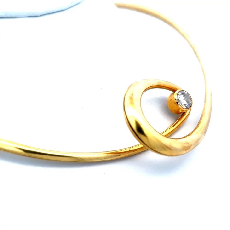 JUHA KOSKELA GOLD CUFF NECKLACE 18K YELLOW SPIRAL LOOP BEZEL STONE: JUHA KOSKELA GOLD CUFF NECKLACE 18K YELLOW SPIRAL LOOP BEZEL STONE This unique cuff necklace is by Finnish designer Juha Koskela, it is a stunning piece of fine jewelry featuring a spiral loop at the 