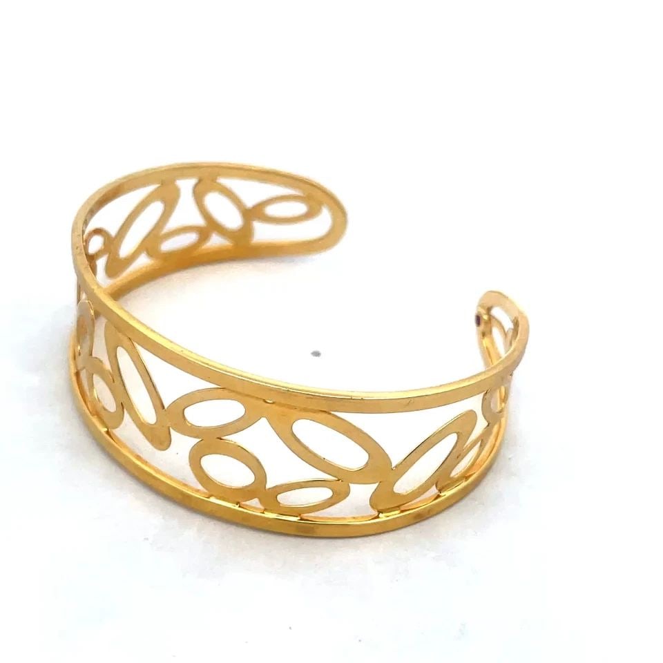 ROBERTO COIN GOLD BRACELET CHIC AND SHINE OPEN STYLE WIDE CUFF 18K: This chic authentic bracelet is by Roberto Coin from the Chic and Shine Collection. Crafted in Italy, this exquisite 18k yellow gold cuff boasts a classic open style with assorted size oval shape ring