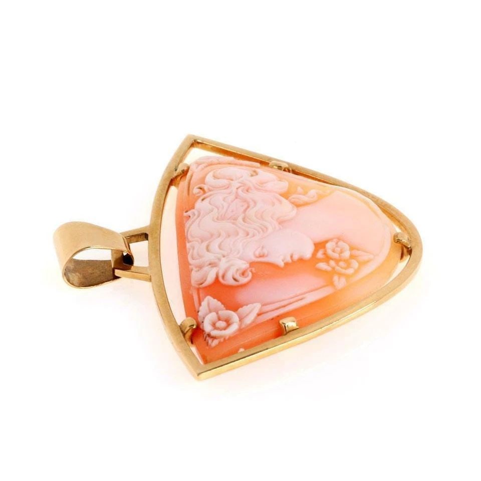 CARTIER CAMEO PENDANT 18K YELLOW GOLD WOMEN'S PROFILE: Cartier Vintage 18k Yellow Gold Shell Cameo Girl Dangle Pendant Description This lovely vintage Cartier pendant is crafted from 18k yellow gold with a polished finish. It features a triangular like sh