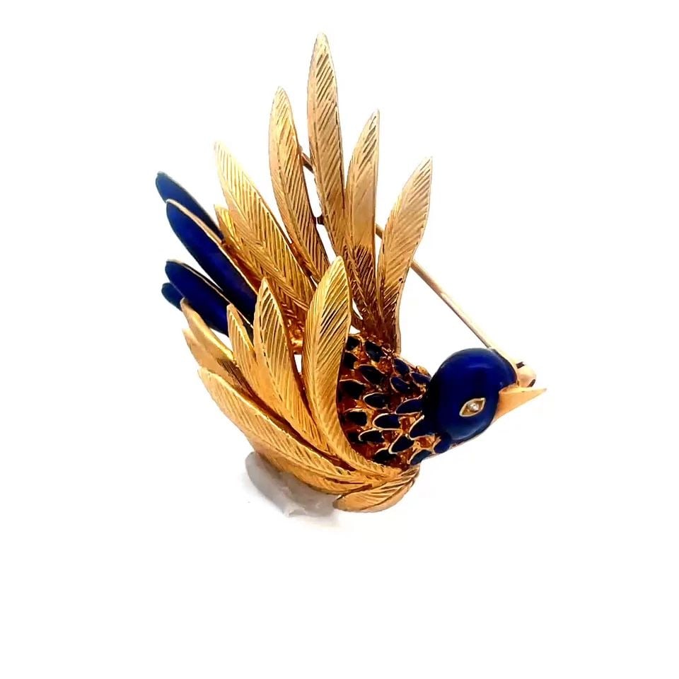 GOLD ENAMEL BROOCH DIAMOND 18K YELLOW 1960'S "BIRD IN FLIGHT" PIN: This eye-catching vintage brooch is crafted from 18k yellow gold, it features the signature style of the 1960's "Bird in Flight" brooch with its cobalt enamel head and segmented feathers with gold aro