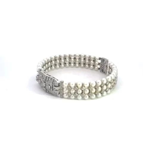 DIAMOND PEARLS 18K ESTATE WHITE GOLD CENTER MOTIF TRIPLE ROW BRACELET: DIAMOND PEARLS 18K ESTATE WHITE GOLD CENTER MOTIF TRIPLE ROW BRACELET This beautiful estate bracelet is crafted from 18k white gold featuring an open design long rectangle shape center motif decorated