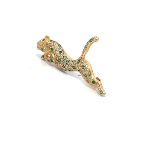 DIAMOND EMERALD PANTHER BROOCH 14K YELLOW GOLD FULL FIGURE: DIAMOND EMERALD PANTHER BROOCH 14K YELLOW GOLD FULL FIGURE This is an elegant brooch; it is crafted from 14k yellow gold featuring a leaping panther with tail up and the entire front of the panther ha