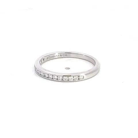 TIFFANY & CO. WEDDING BAND DIAMOND PLATINUM RING: TIFFANY & CO. WEDDING BAND DIAMOND PLATINUM RING Authentic and elegant from Tiffany & Co. This delicate feminine band is crafted from platinum with a high polished finish. The front half of the band h