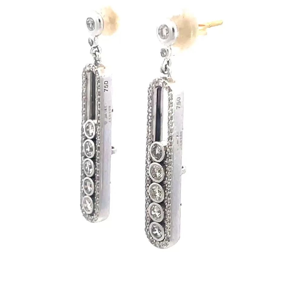 DIAMOND GOLD DANGLE EARRINGS 18K WHITE LONG BAR BEZEL SET MOVING DIAMONDS: DIAMOND GOLD DANGLE EARRINGS 18K WHITE LONG BAR BEZEL SET MOVING DIAMONDS These elegant dangle earrings are crafted from 18k white gold with 14k gold backs, the pair features a bezel set stud top with