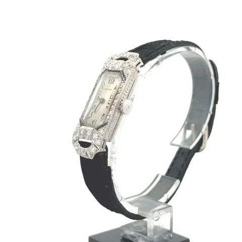 ART DECO DIAMOND PLATINUM HAND WIND ELONGATED LADIES WATCH: ART DECO DIAMOND PLATINUM HAND WIND ELONGATED LADIES WATCH This is a lovely Art Deco platinum hand wind ladies watch, the frame is a rectangle shape with elongated fancy lugs with diamonds around the 