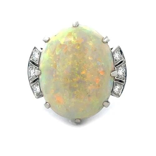 TIFFANY & CO. OPAL RING DIAMOND PLATINUM 16.74CT OVAL TOP COCKTAIL STYLE VINTAGE: TIFFANY & CO. OPAL RING DIAMOND PLATINUM 16.74CT OVAL TOP COCKTAIL STYLE VINTAGE This stunning cocktail ring is from Tiffany & Co., it is crafted from platinum on a slim open style bridge with 3 diamo