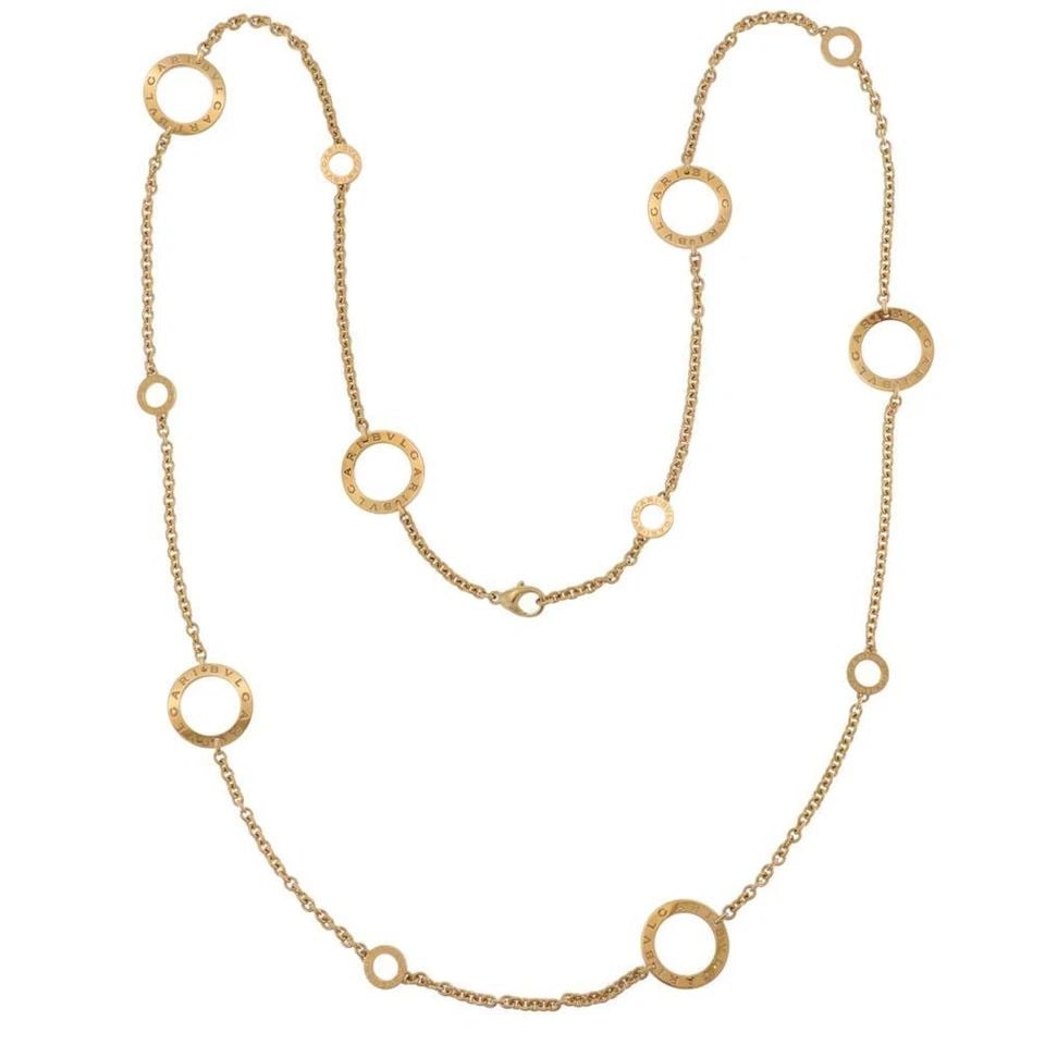 BVLGARI 18K YELLOW GOLD SIGNATURE 6 LARGE CIRCLE MOTIF NECKLACE 37"L: BVLGARI 18K YELLOW GOLD SIGNATURE 6 LARGE CIRCLE MOTIF NECKLACE 37"L Bvlgari 18k Yellow Gold Signature 6 Large Circle Motif Necklace 37"L Description Elite and authentic by Bvlgari from the Signature 