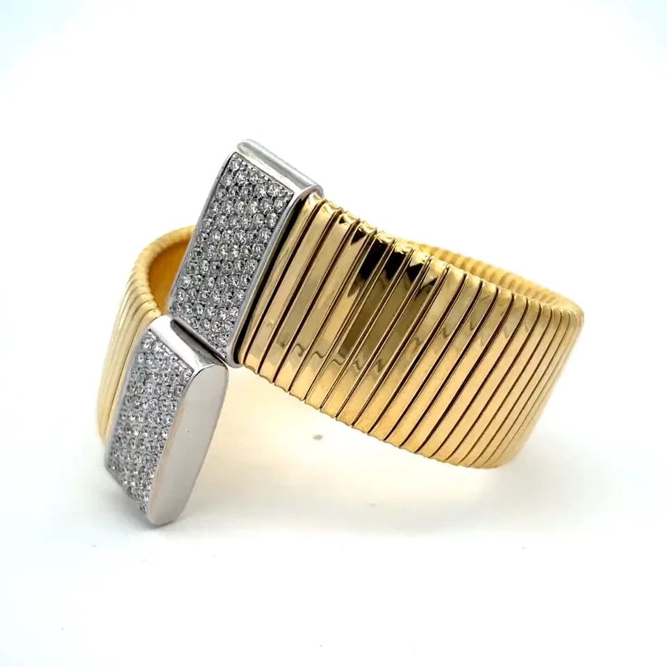 SNAKE GOLD BRACELET DIAMONDS 18K YELLOW 23MM WIDE TUBOGAS BYPASS: SNAKE GOLD BRACELET DIAMONDS 18K YELLOW 23MM WIDE TUBOGAS BYPASS Chic Diamonds 18k Yellow White Gold 23mm Wide Tubogas Bypass Bracelet Description This is a chic fashionable wide flex bracelet, it is 