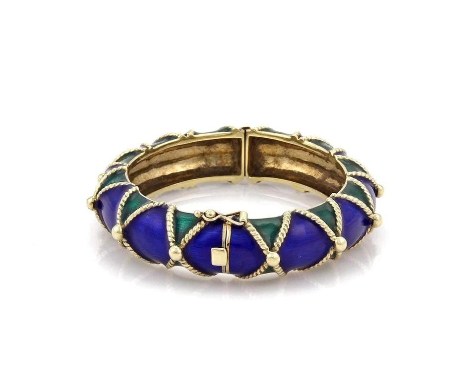 BANGLE 14K YELLOW GOLD BLUE & GREEN ENAMEL FANCY DOME 84GRAMS RETRO: BANGLE 14K YELLOW GOLD BLUE & GREEN ENAMEL FANCY DOME 84GRAMS RETRO This Bangle bracelet is crafted from 14k yellow gold and features a fancy dome design adorned with blue and green enamel. The retro-