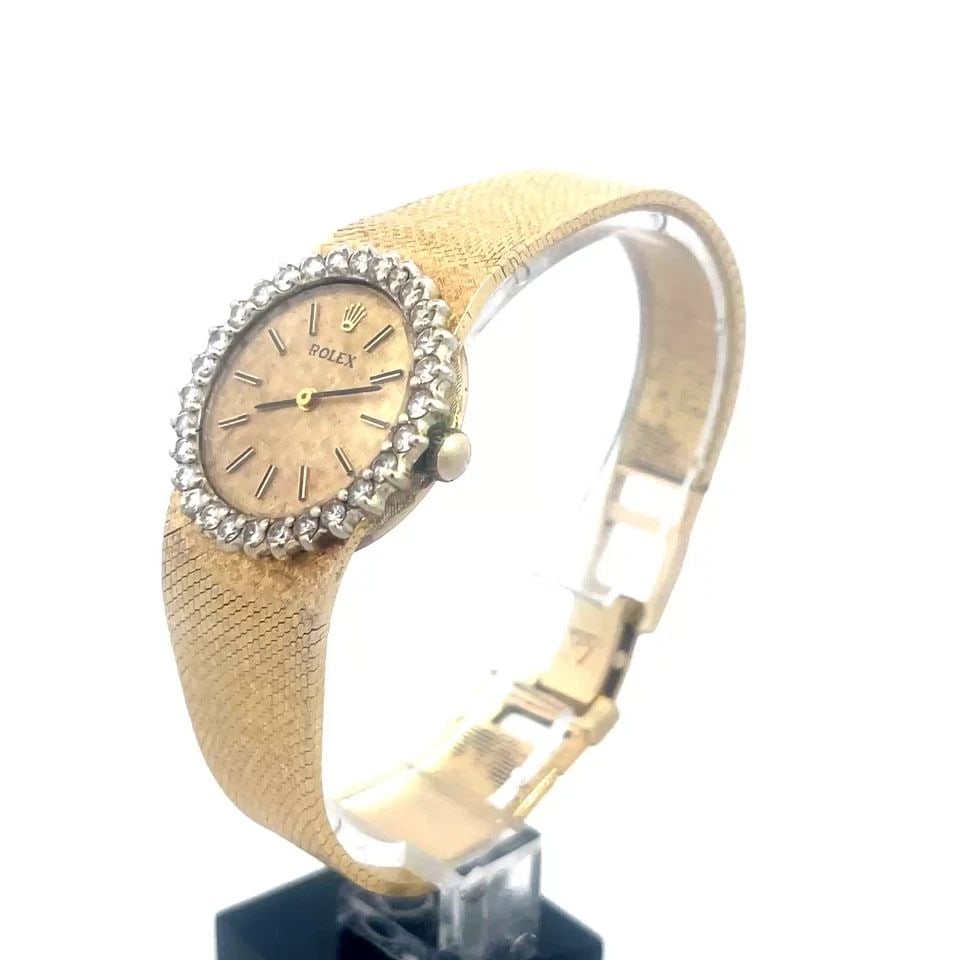 ROLEX DIAMOND GOLD WATCH 14K YELLOW VINTAGE LADIES HAND WIND: ROLEX DIAMOND GOLD WATCH 14K YELLOW VINTAGE LADIES HAND WIND This Rolex Diamond gold watch is a vintage luxury wristwatch designed for women. This manual hand wind watch features a yellow gold case wi