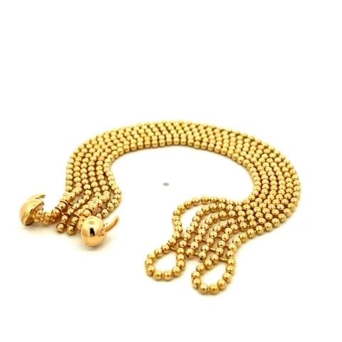 CARTIER DRAPERIE DE DECOLLETE 6 STRAND 18K YELLOW GOLD BEAD BRACELET PAPER: CARTIER DRAPERIE DE DECOLLETE 6 STRAND 18K YELLOW GOLD BEAD BRACELET PAPER This chic authentic bracelet by Cartier from the Draperie Decollete Collection. It is well crafted from 18k yellow gold in a 