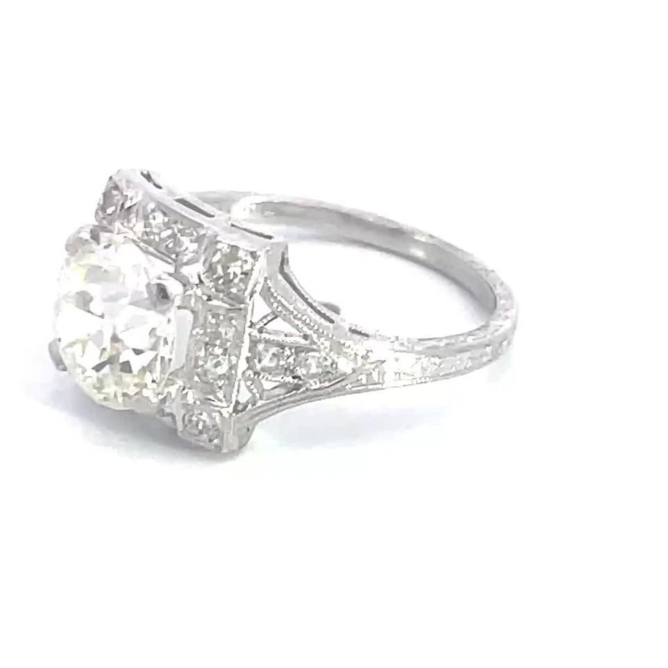 ART DECO DIAMOND RING EUROPEAN CUT 2.15 CT PLATINUM MILGRAIN STYLE SOLIRAIRE: ART DECO DIAMOND RING EUROPEAN CUT 2.15 CT PLATINUM MILGRAIN STYLE SOLIRAIRE Crafted with precision, this Art Deco Old European cut Cut diamond ring exemplifies timeless elegance. A 2.15-2.30-carat na