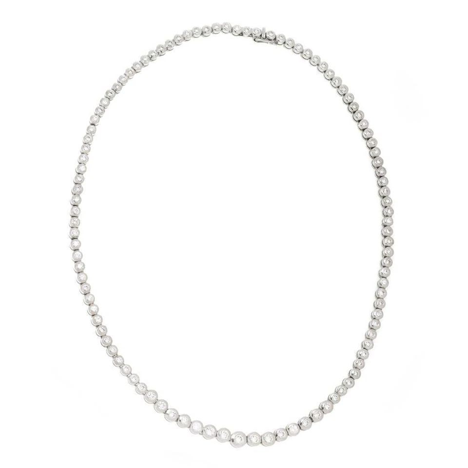 TENNIS NECKLACE PLATINUM 4.00 CARAT DIAMOND GRADUATED CENTER ETERNITY BEZEL SET: TENNIS NECKLACE PLATINUM 4.00 CARAT DIAMOND GRADUATED CENTER ETERNITY BEZEL SET 55274- 3.00 Carats Diamond 14k White Gold Graduated Prong Set Tennis Necklace Description This gorgeous diamond tennis