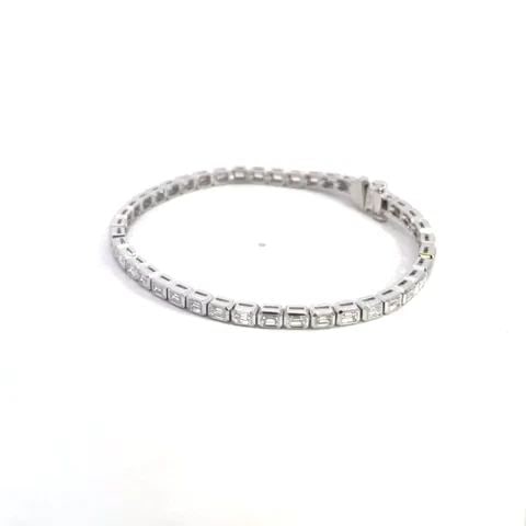 DIAMOND LINE TENNIS BRACELET EMERALD CUT 4.35CT 18K WHITE GOLD NEW: DIAMOND LINE TENNIS BRACELET EMERALD CUT 4.35CT 18K WHITE GOLD NEW This is a gorgeous NEW line tennis bracelet. It is crafted from 18k white gold with a polished finish featuring the entire length of