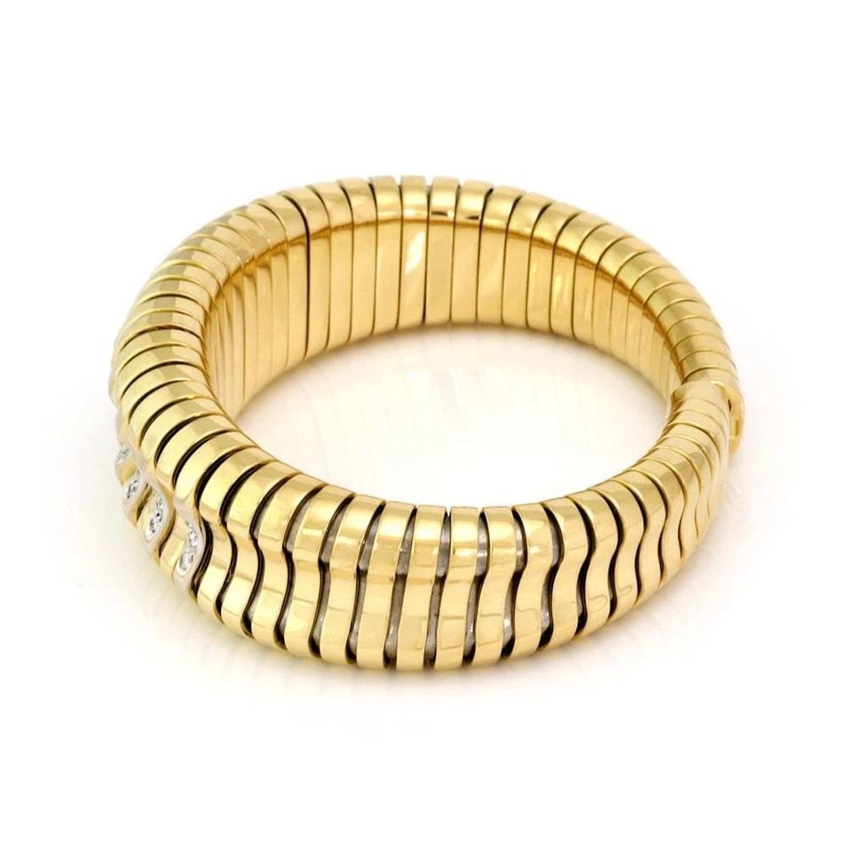 ESTATE DIAMOND 18K YELLOW GOLD LARGE TUBOGAS FLEX CUFF BRACELET: ESTATE DIAMOND 18K YELLOW GOLD LARGE TUBOGAS FLEX CUFF BRACELET Estate Diamond 18k Yellow Gold Large Tubogas Flex Cuff Bracelet Description This is a gorgeous large cuff bracelet, it is crafted from