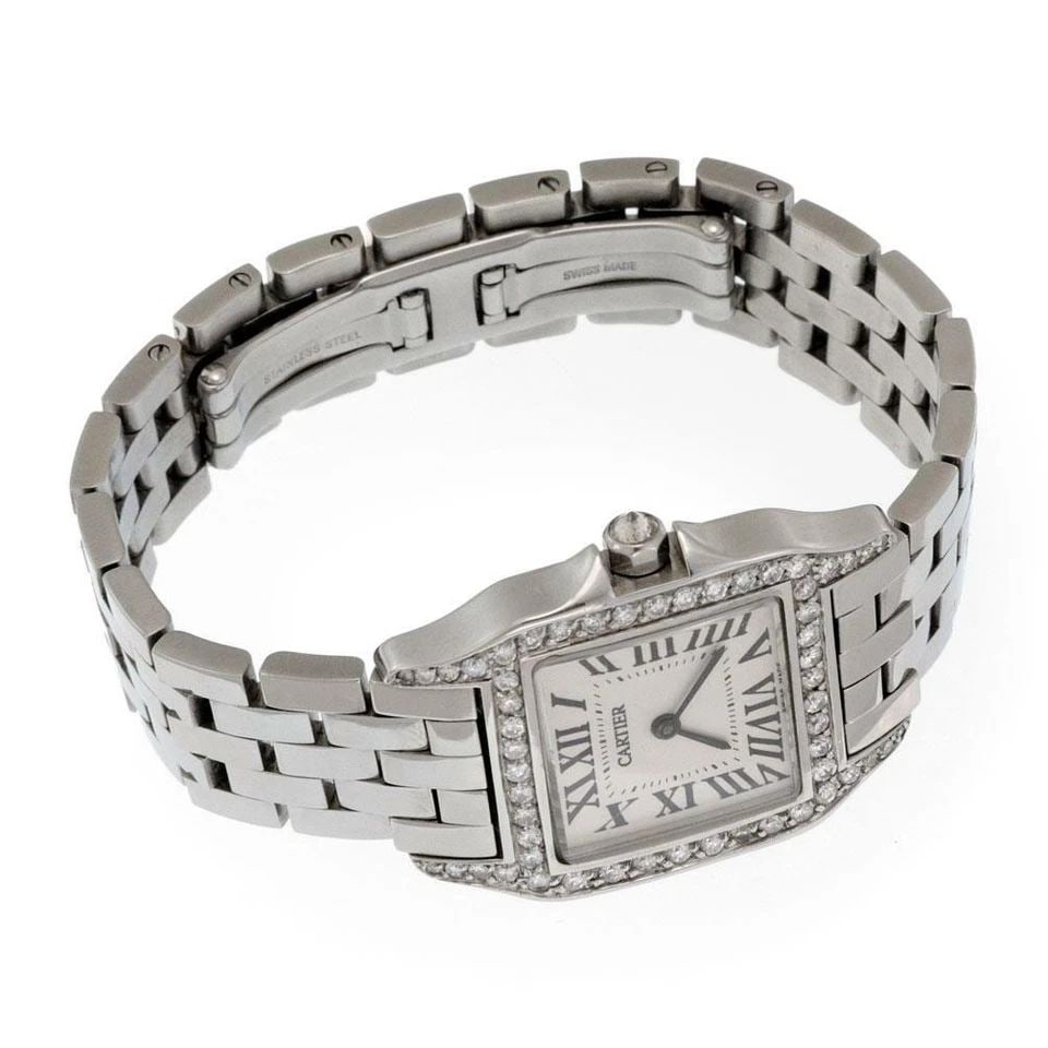 CARTIER WATCH SANTOS DEMOISEL DIAMOND BEZEL STAINLESS STEEL MIDSIZ QUARTZ: The Cartier Watch Santos Demoisel Diamond Bezel Stainless Steel Midsiz Quartz is a luxurious wristwatch designed for men. It features a square case with a stainless steel and silver construction, acce