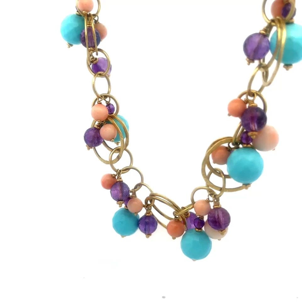 SILVIA KELLY GOLD NECKLACE 18K YELLOW BEADED GEMS MULTI-RING CHAIN: The Silvia Kelly Gold Necklace features assorted style faceted cut bead gemstones with larger turquoise and amethyst and coral beads dangling from small round links attached to ring links which includ