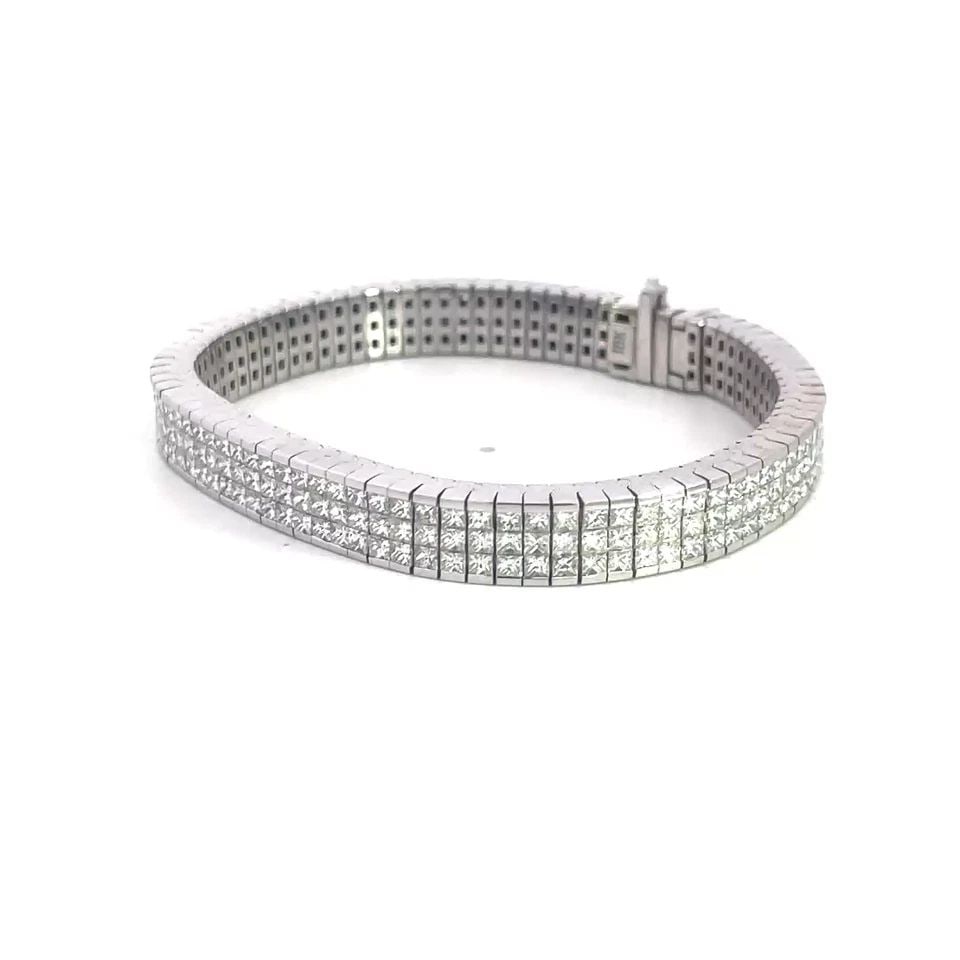 DIAMOND 18K GOLD BRACELET 8CT PRINCESS CUT INVISIBLE SET WIDE BAND 6.5": DIAMOND 18K GOLD BRACELET 8CT PRINCESS CUT INVISIBLE SET WIDE BAND 6.5" This sparkling eye-catching bracelet is crafted from 18k white gold featuring a flexible cube style section links with invisible