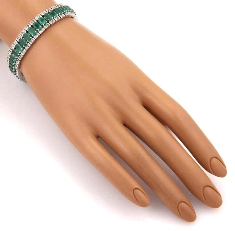 EMERALD &DIAMOND BRACELET 14K WHITE GOLD FLEX LINK ESTATE W/APPRAISAL: EMERALD &DIAMOND BRACELET 14K WHITE GOLD FLEX LINK ESTATE W/APPRAISAL This lovely wide flex link tennis bracelet is crafted from 14k white gold with a polished finish; it has faceted oval shape genuin