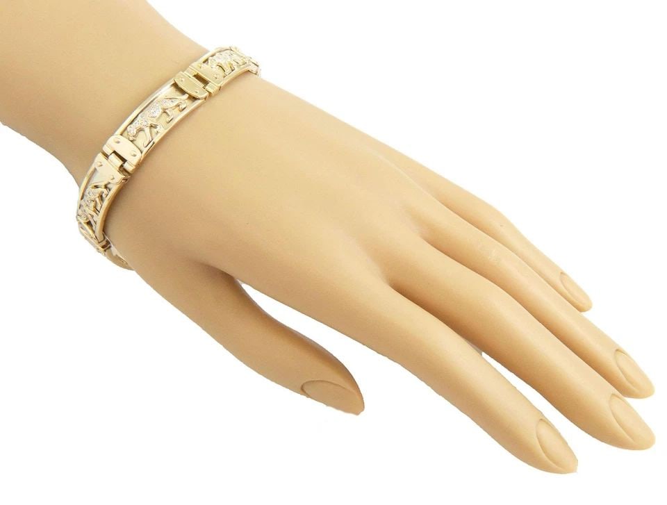 DIAMOND 14K YELLOW GOLD PANTHER BAR LINK 10MM WIDE BRACELET 8.5" LONG: DIAMOND 14K YELLOW GOLD PANTHER BAR LINK 10MM WIDE BRACELET 8.5" LONG Estate 14k Yellow Gold Diamond Panther Bar Link Bracelet 8.5" Long Description This is a bold bracelet, crafted from 14k yellow go