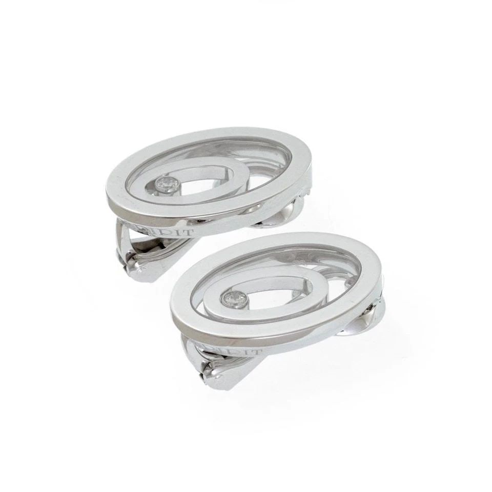 CHOPARD HAPPY SPIRIT DIAMOND 18K WHITE GOLD DOUBLE OVAL CLIP ON EARRINGS: CHOPARD HAPPY SPIRIT DIAMOND 18K WHITE GOLD DOUBLE OVAL CLIP ON EARRINGS The Chopard Happy Spirit Diamond 18k White Gold Double Oval Clip-On Earrings are a luxurious and elegant piece of fine jewelry.