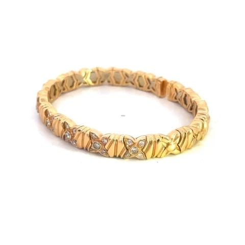 GIOVANE DIAMOND GOLD BRACELET 18K YELLOW FLORAL MOTIFS FLEX BAND: GIOVANE DIAMOND GOLD BRACELET 18K YELLOW FLORAL MOTIFS FLEX BAND From Italian designer Giovane, this authentic bracelet is crafted from 18k yellow gold with a small open back. The entire 7mm wide band