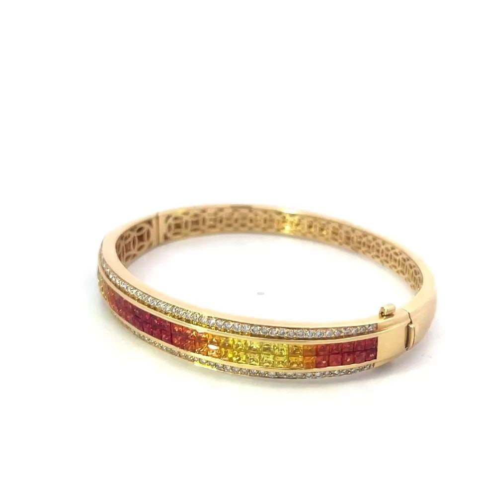 DIAMOND SAPPHIRE GOLD BRACELET 18K YELLOW MULTI COLOR RAINBOW SAPPHIRE: DIAMOND SAPPHIRE GOLD BRACELET 18K YELLOW MULTI COLOR RAINBOW SAPPHIRE This is a beautiful hinged oval shaped bracelet, it is crafted from 18k yellow gold with a polished finish. The front half has do