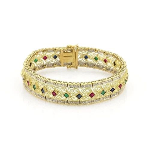 DIAMOND & GEMS GOLD BRACELET 14K YELLOW WIDE FILIGREE STYLE: DIAMOND & GEMS GOLD BRACELET 14K YELLOW WIDE FILIGREE STYLE This is a lovely, impressive Estate bracelet is crafted from 14k yellow gold with a fine polished finish and a beautiful open filigree desig