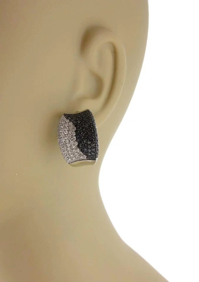 DIAMOND GOLD EARRINGS 14KT WHITE CONCAVE STYLE HUGGIES: DIAMOND GOLD EARRINGS 14KT WHITE CONCAVE STYLE HUGGIES These Diamond Gold Earrings are a stylish choice for those looking for a unique and elegant accessory. The concave style and huggie design hug th
