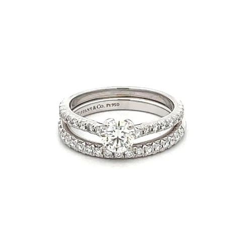 TIFFANY &CO. ENGAGEMENT WEDDING RING SET PLATINUM SOLITAIRE W/ACCENT & BAND: TIFFANY &CO. ENGAGEMENT WEDDING RING SET PLATINUM SOLITAIRE W/ACCENT & BAND This elegant authentic wedding ring and band set is from Tiffany & Co. They are crafted from platinum with a polished finish