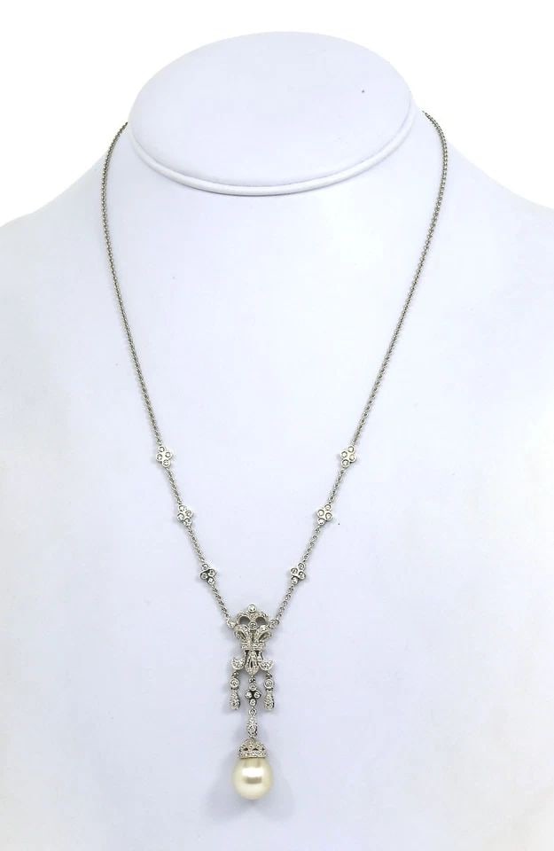DIAMOND SOUTH SEA PEARL NECKLACE 18K WHITE GOLD FLORAL DANGLE PENDANT & CHAIN: DIAMOND SOUTH SEA PEARL NECKLACE 18K WHITE GOLD FLORAL DANGLE PENDANT & CHAIN This Diamond South Sea Pearl Necklace features a stunning floral dangle pendant crafted from 18k white gold. The natural w