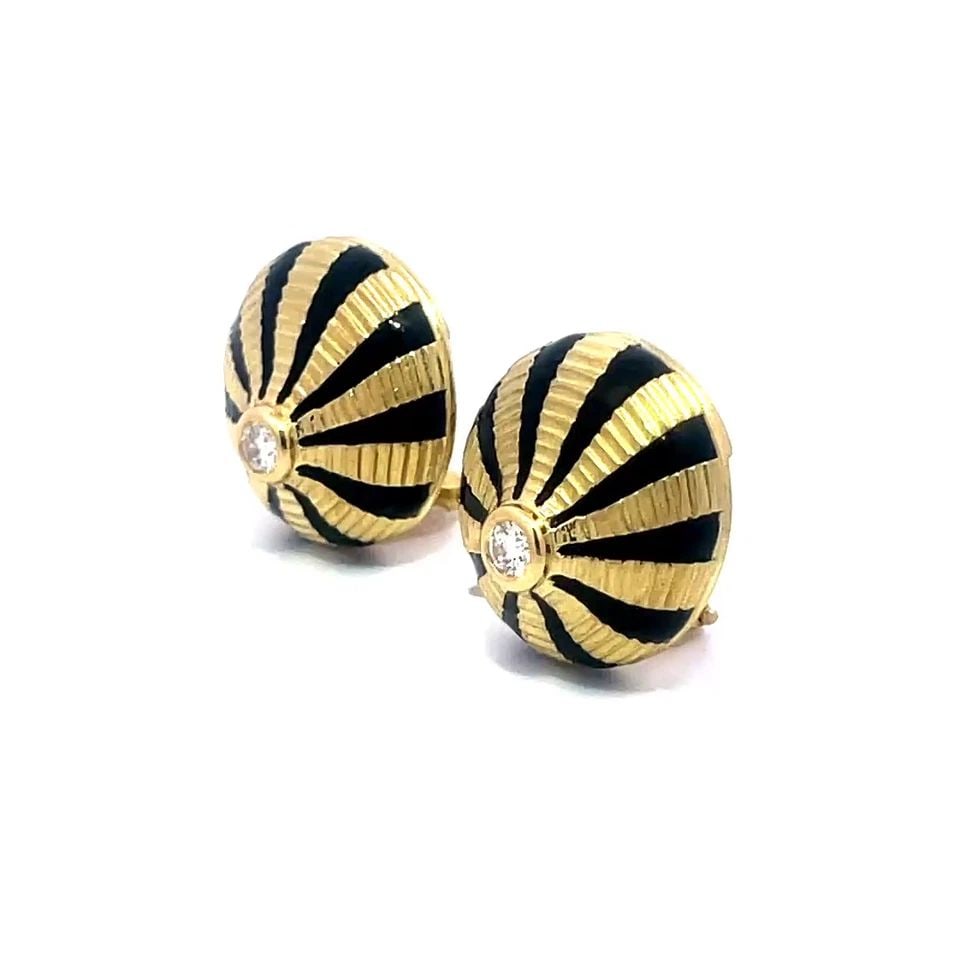 TIFFANY & CO. SCHLUMBERGER GOLD EARRINGS DIAMOND ENAMEL 18K YELLOW WHEEL: These gorgeous Tiffany & Co. earrings by designer Schlumberger are crafted from 18k yellow gold featuring round grooved design, the earrings feature alternating gold with black enamel stripes radiatin