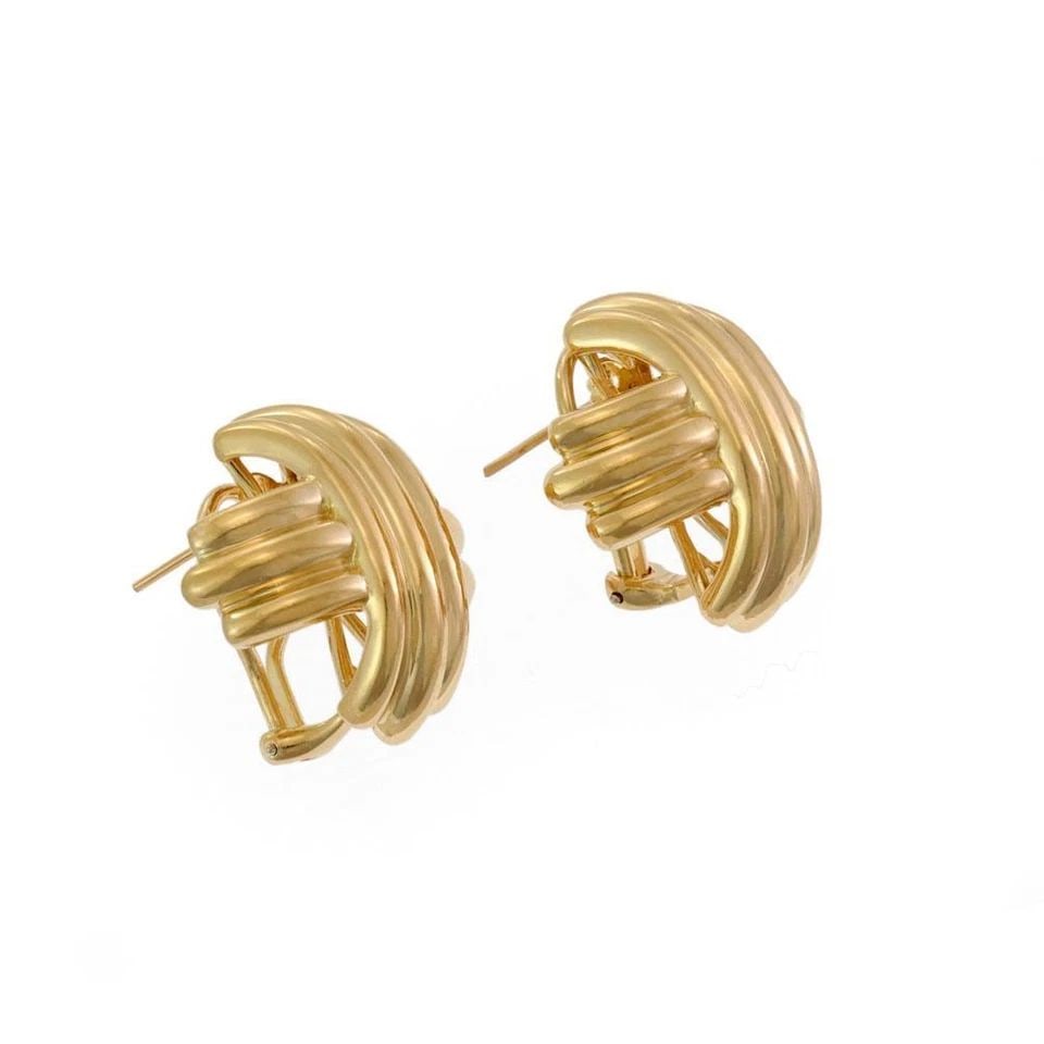 TIFFANY & CO. EARRINGS 18K YELLOW GOLD SIGNATURE X POST & CLIP: The Tiffany & Co. Earrings in 18K Yellow Gold with Signature X design are a luxurious and elegant piece of fine jewelry. Made in Italy, these huggie style earrings feature an omega back closure for se
