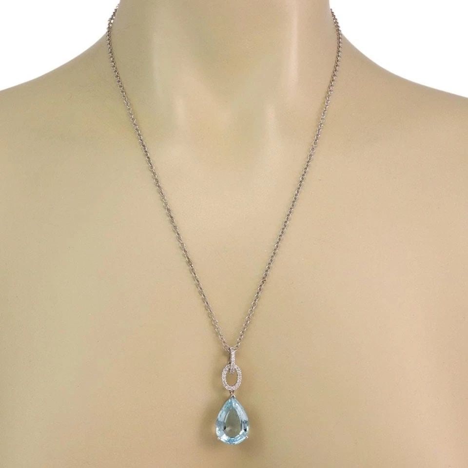 AQUAMARINE DIAMOND GOLD NECKLACE 18K 14K WHITE PENDANT & CHAIN: AQUAMARINE DIAMOND GOLD NECKLACE 18K 14K WHITE PENDANT & CHAIN This is a stunning pendant and chain necklace, it is crafted from 18k and 14k white gold featuring a double pear-shaped frame holding a l