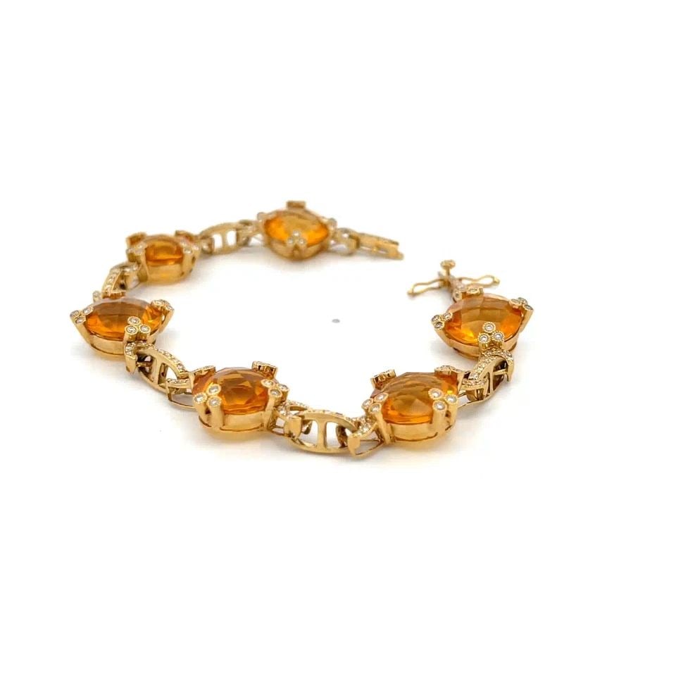 CITRINE & DIAMOND GOLD BRACELET 18K YELLOW GOLD FLORAL ROUND LINK: CITRINE & DIAMOND GOLD BRACELET 18K YELLOW GOLD FLORAL ROUND LINK This gorgeous bracelet is crafted in 18k yellow gold featuring 6 round faceted cut citrine gemstones held securely by floral set prong