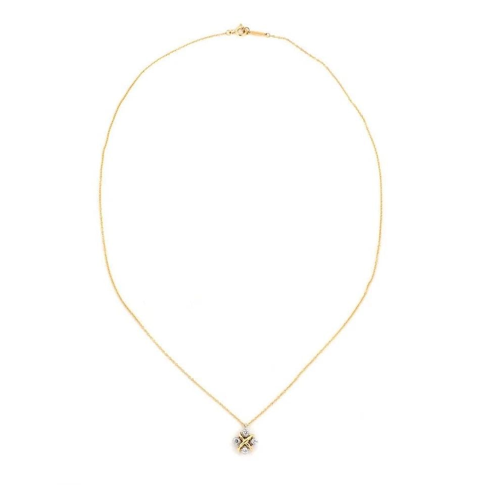 TIFFANY & CO. DIAMOND PLATINUM 18K YELLOW GOLD X PENDANT & CHAIN: TIFFANY & CO. DIAMOND PLATINUM 18K YELLOW GOLD X PENDANT & CHAIN Tiffany & Co. Diamond Platinum 18k Yellow Gold X Pendant & Chain Description This elegant authentic pendant and chain is from Tiffany &
