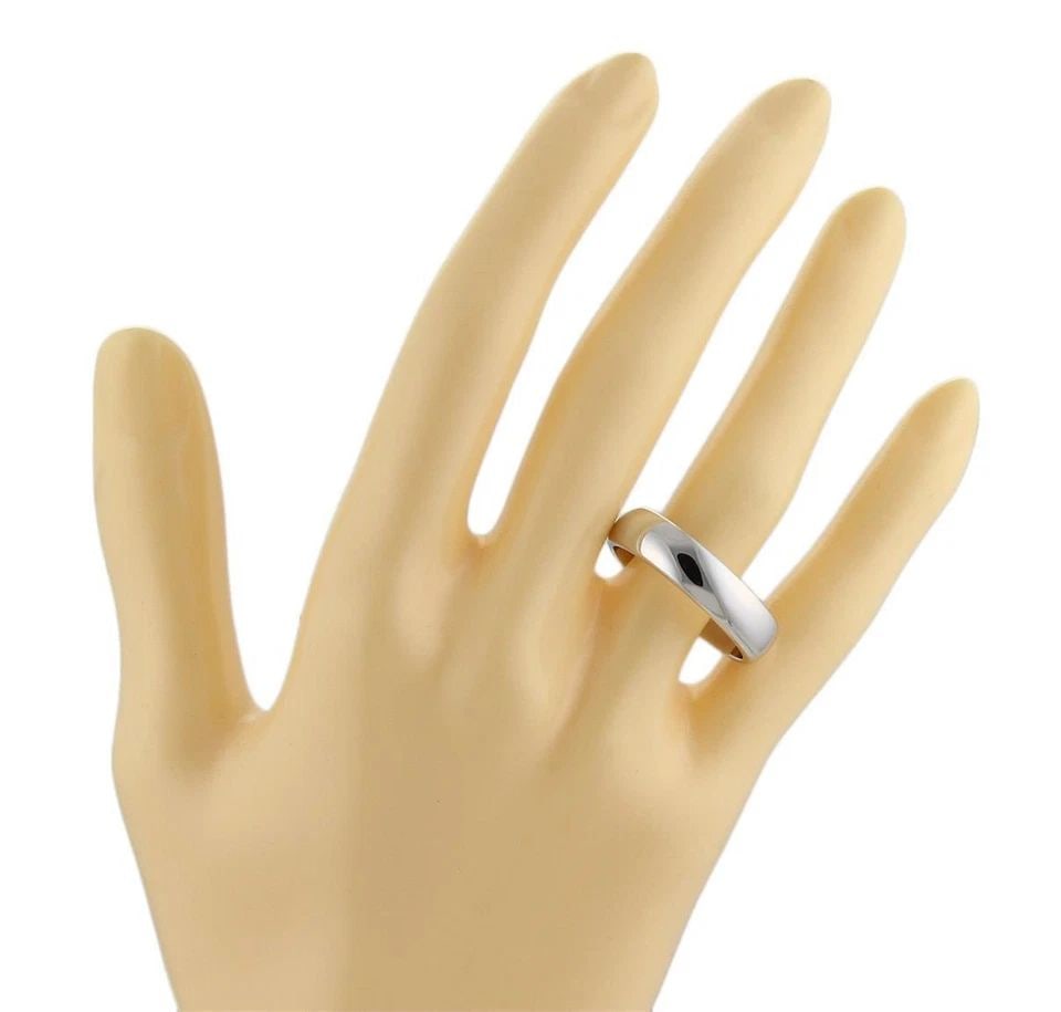 TIFFANY & CO. RING PLATINUM 6MM WIDE DOME BAND SIZE 9.5: TIFFANY & CO. RING PLATINUM 6MM WIDE DOME BAND SIZE 9.5 The product is a Tiffany & Co. platinum ring with a 6mm wide dome band, designed in a size 9.5. Made in the United States, this ring features a 