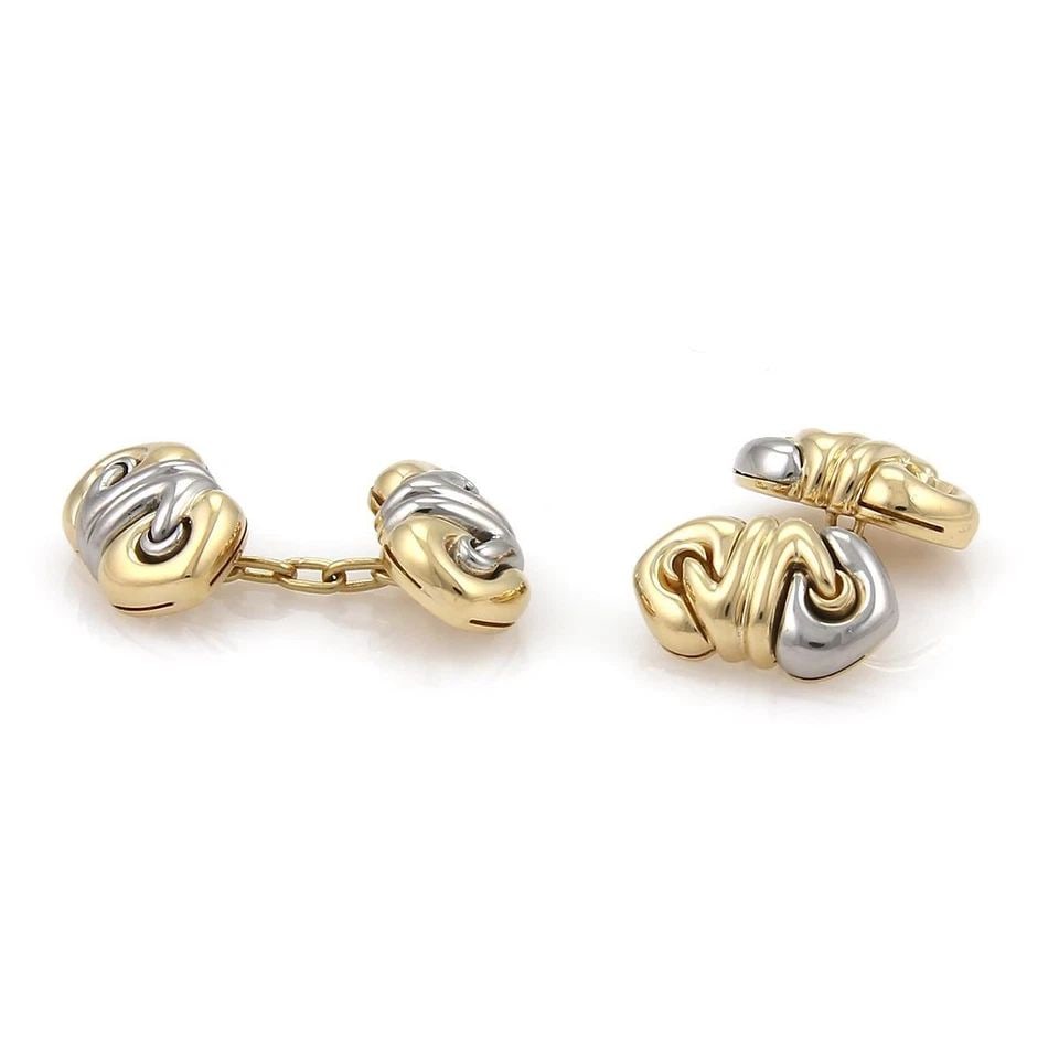 BVLGARI BULGARI “DOPPIO CUORE?? 18K YELLOW GOLD & STEEL CHAIN CUFFLINKS: BVLGARI BULGARI “DOPPIO CUORE” 18K YELLOW GOLD & STEEL CHAIN CUFFLINKS Bvlgari Bulgari “Doppio Cuore” 18k Yellow Gold & Steel Chain Cufflinks Description This is a lovely pair of authe