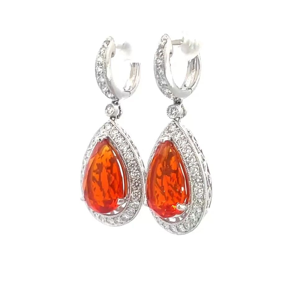 DIAMOND MEXICAN OPAL GOLD EARRINGS 18K WHITE PEAR SHAPE DANGLE STYLE: DIAMOND MEXICAN OPAL GOLD EARRINGS 18K WHITE PEAR SHAPE DANGLE STYLE This is a stunning pair of drop dangle earrings; they are crafted from 18k white gold featuring a huggie hoop top with diamonds on 
