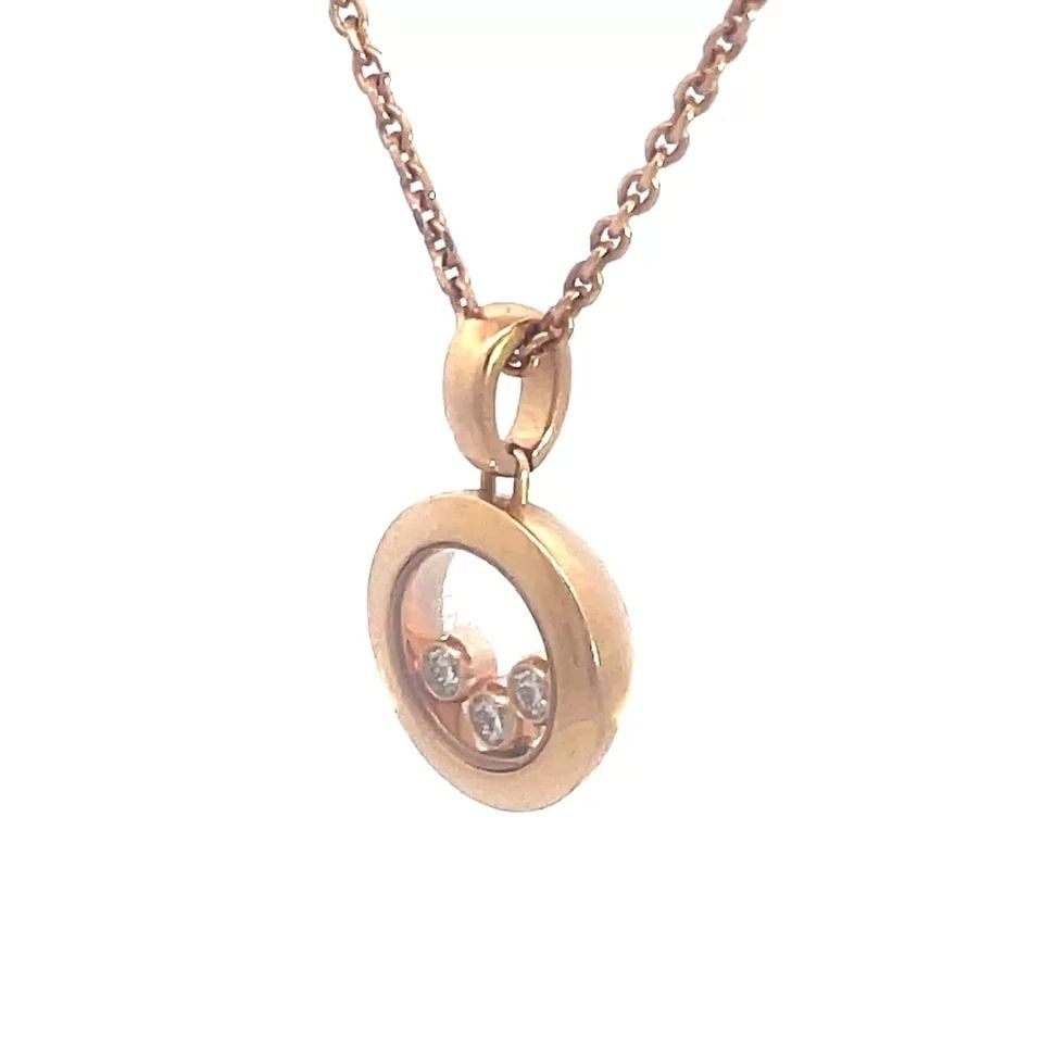 CHOPARD HAPPY DIAMOND GOLD NECKLACE 18K ROSE ROUND PENDANT: CHOPARD HAPPY DIAMOND GOLD NECKLACE 18K ROSE ROUND PENDANT This lovely Chopard Happy Diamond necklace is a stunning piece of fine jewelry featuring a 18k rose gold round pendant with 3 bezel set diamo