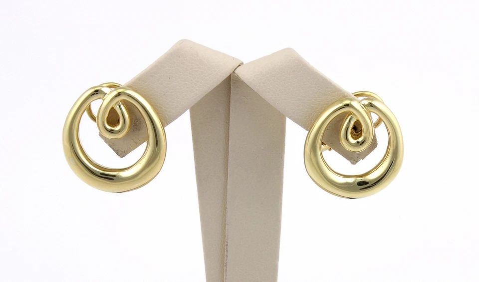 TIFFANY & CO. GOLD LOOP EARRINGS 18K YELLOW POST CLIP W/BOX: TIFFANY & CO. GOLD LOOP EARRINGS 18K YELLOW POST CLIP W/BOX These Tiffany & Co. Gold Loop Earrings are crafted from 18k yellow gold and feature an oval shape with an omega back closure for a secure fi