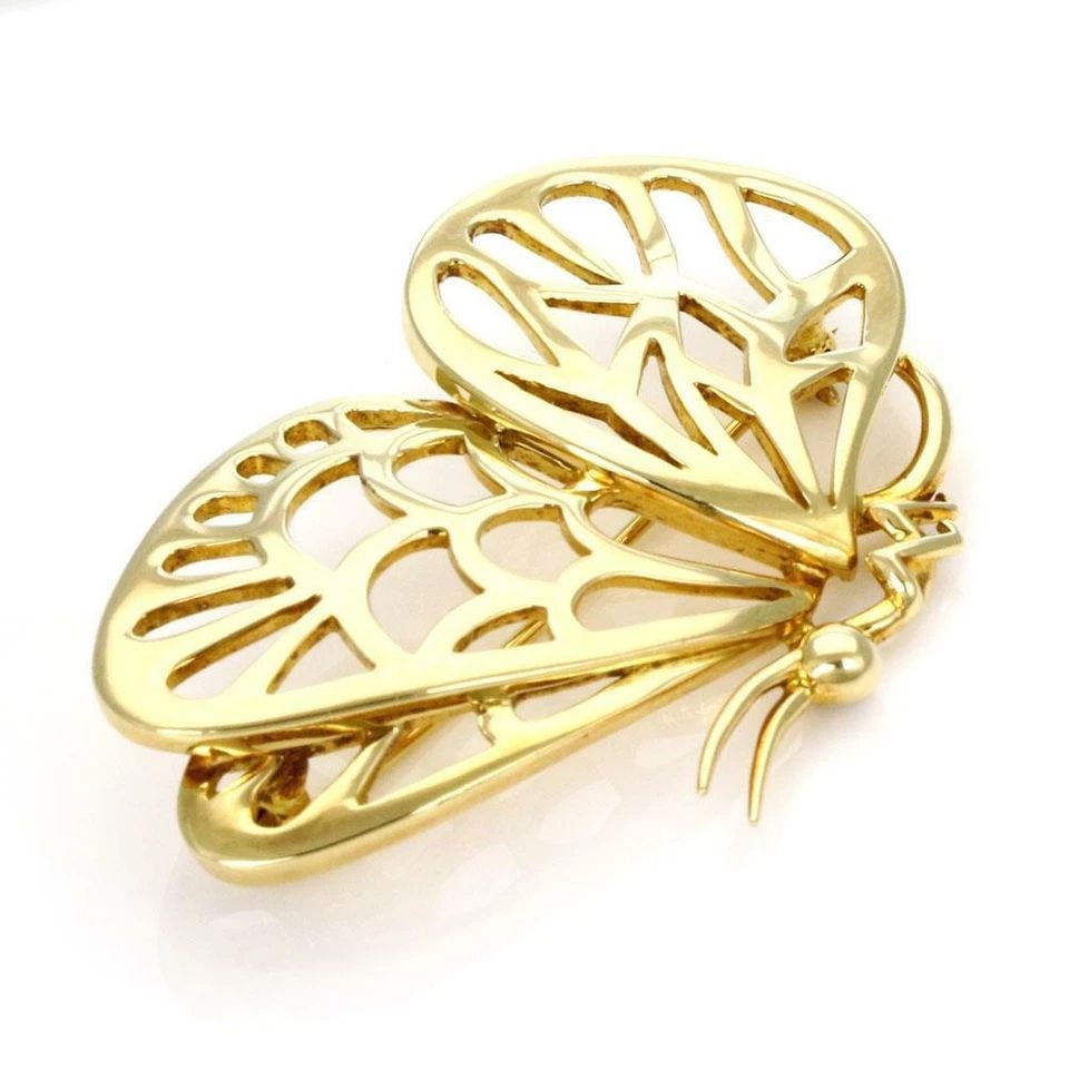 TIFFANY & CO. BROOCH/PIN BUTTERFLY VINTAGE 18K YELLOW GOLD OPEN DESIGN: TIFFANY & CO. BROOCH/PIN BUTTERFLY VINTAGE 18K YELLOW GOLD OPEN DESIGN The Tiffany & Co. Vintage 18k Yellow Gold Butterfly Brooch/Pin is a delightful piece of fine jewelry from the United States. With