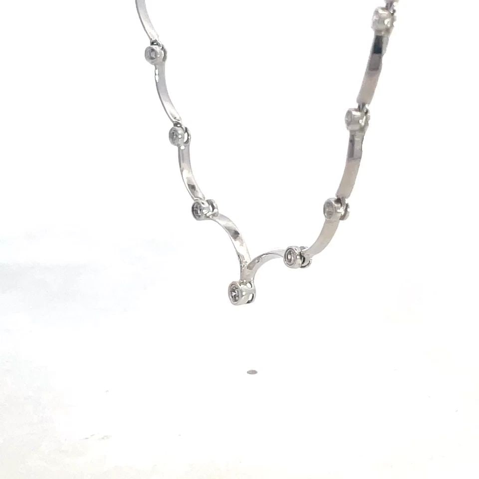 DIAMOND GOLD NECKLACE 18K WHITE CURVED BAR DOT LINKS FOR EVERY DAY WEAR: DIAMOND GOLD NECKLACE 18K WHITE CURVED BAR DOT LINKS FOR EVERY DAY WEAR This elegant collar necklace is crafted from 18k white gold featuring the front center of the necklace with round bezel set diam