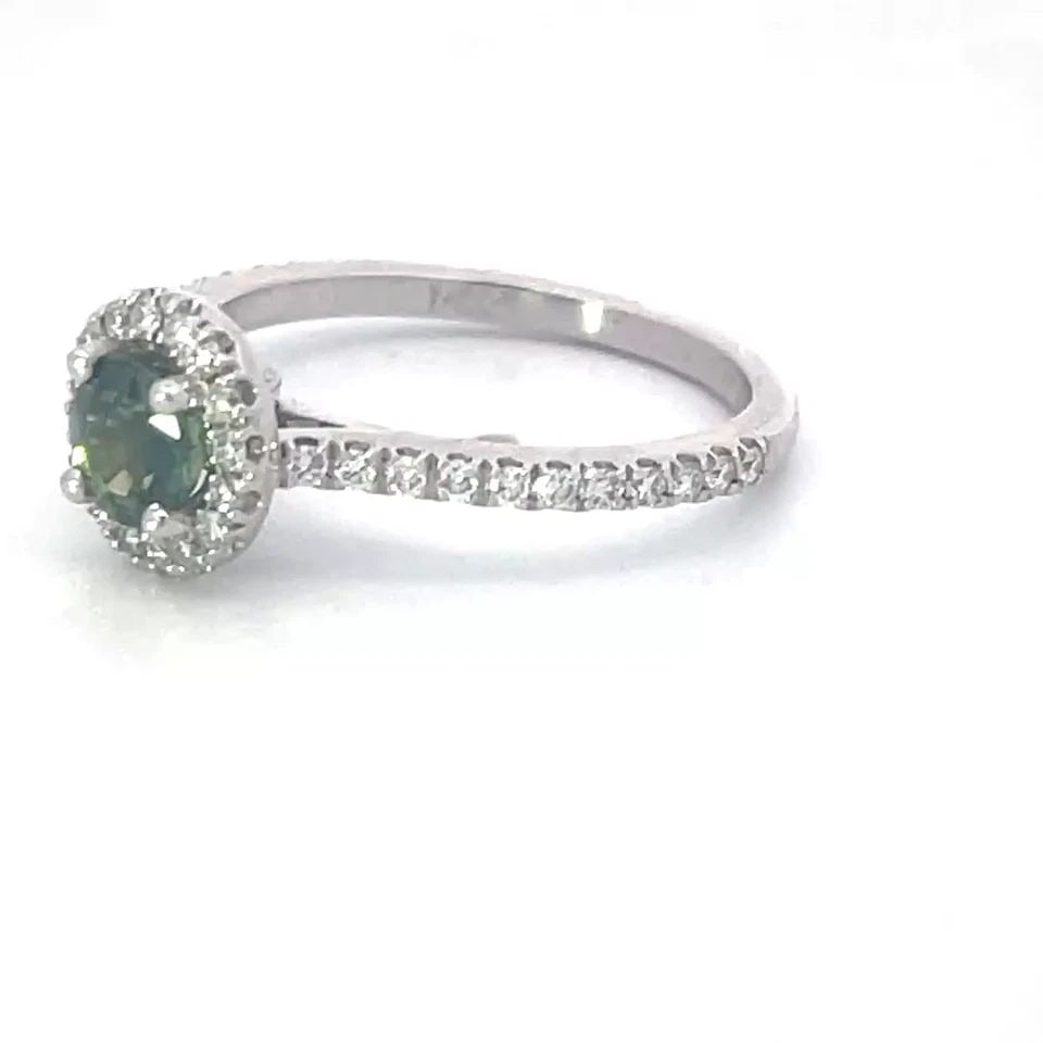 ALEXANDRITE DIAMOND GOLD RING 14K WHITE SOLITAIRE W/HALO: ALEXANDRITE DIAMOND GOLD RING 14K WHITE SOLITAIRE W/HALO This is a beautiful solitaire alexandrite with accent ring, it is crafted from 14k white gold featuring a green alexandrite gemstone in the cen