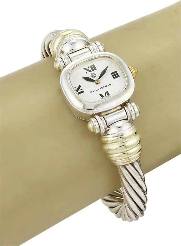 DAVID YURMAN WRISTWATCH STERLING SILVER 14K YELLOW GOLD CABLE BAND QUARTZ 5.75": DAVID YURMAN WRISTWATCH STERLING SILVER 14K YELLOW GOLD CABLE BAND QUARTZ 5.75" The David Yurman wristwatch is a stunning timepiece designed for women, featuring a sterling silver and 14k yellow gold 